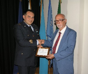 Lt. Col. Guido Giordano, ITAF (l), chapter president, recognizes Professor Italo Biddittu, Prehistoric Museum of Pofi, during the Probi Viri nomination ceremony in October.